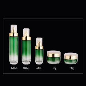 Glass cosmetic skin care bottle set with gradient green glass and gold pump